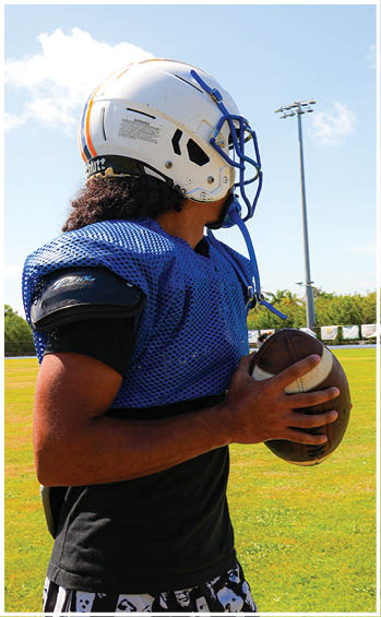 A football player running on the field. Description generated by AI