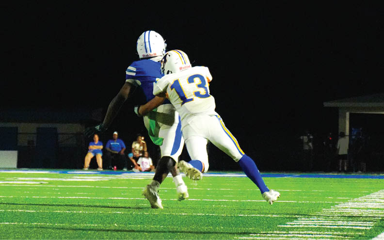 A football player wearing a blue and white jersey with the number 11 on it. Description generated by AI