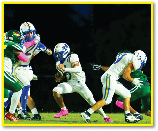 A group of football players wearing black jerseys with the number 3 on them. Description generated by AI