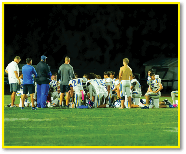 A football player running on the field. Description generated by AI
