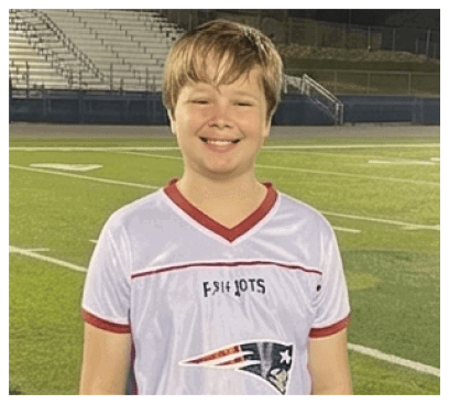 A football player wearing a blue and red jersey. Description generated by AI