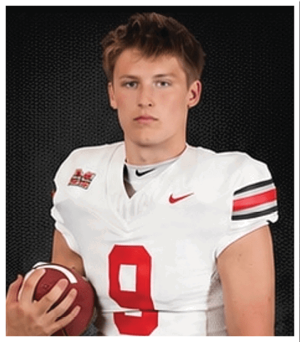 A football player wearing a blue and red jersey. Description generated by AI