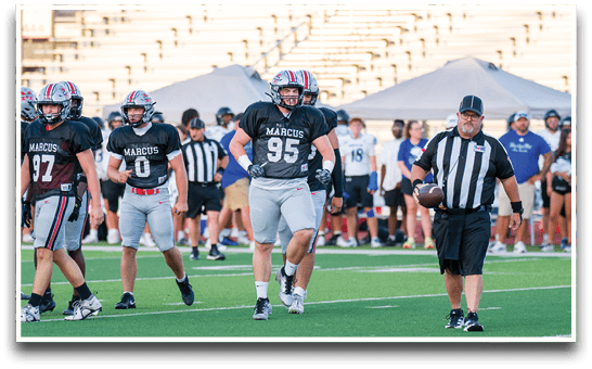 Three football players are standing on the field, one of them is smiling and wearing a black jersey with the number 55. AI generated content