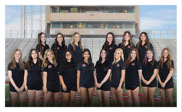 A group of cheerleaders pose for a photo in front of a stadium. AI generated content