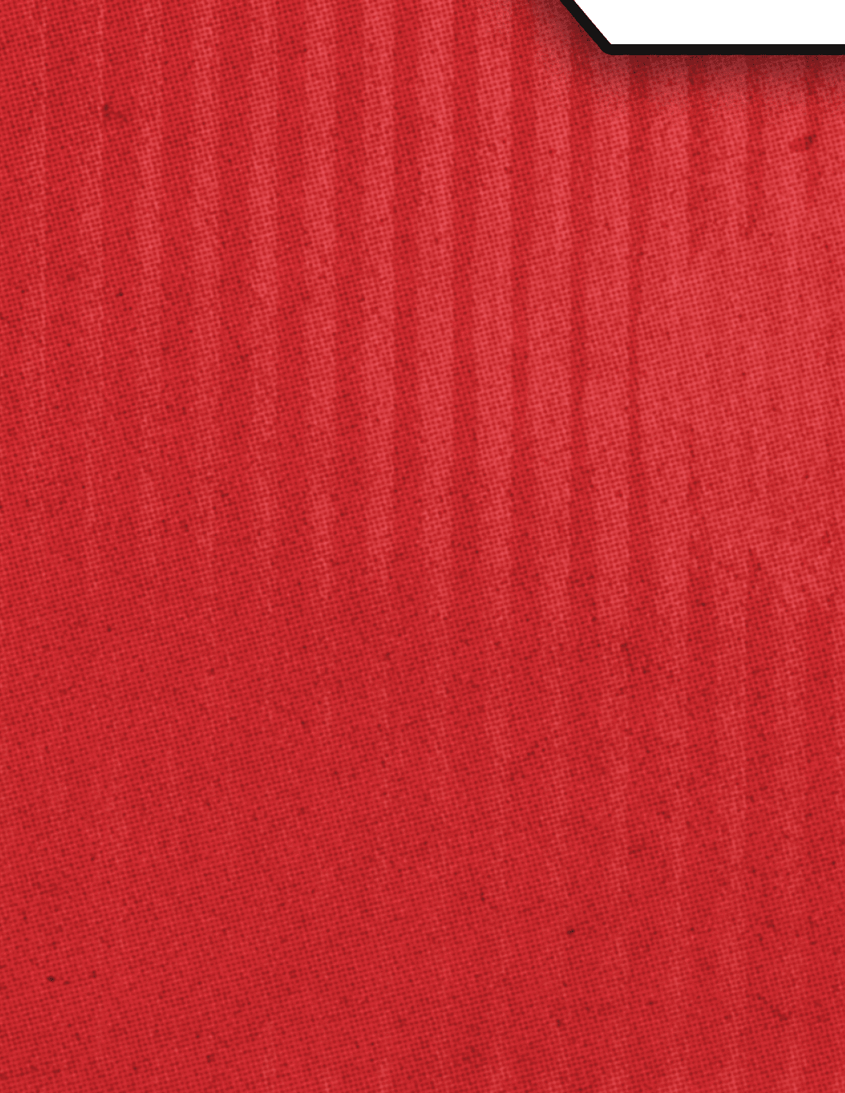 A close-up view of a red textured fabric with subtle vertical lines and a small white corner visible at the top right. Description generated by AI