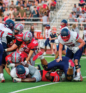 Three football players are standing on the field, one of them is smiling and wearing a black jersey with the number 55. AI generated content