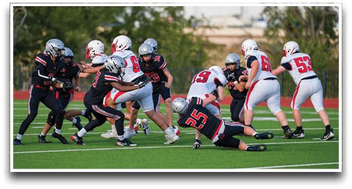Three football players are standing on the field, one of them is smiling and wearing a black jersey with the number 55. AI generated content