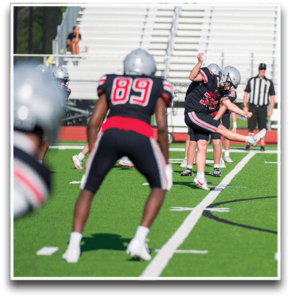 Three football players are standing on the field, one of them is smiling and wearing a black jersey with the number 55. AI generated content