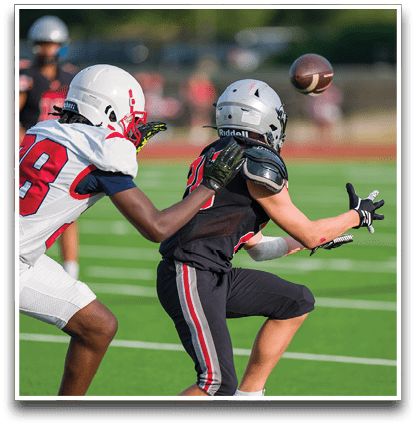 Three football players are standing on the field, one of them is smiling and wearing a black jersey with the number 55. AI generated content