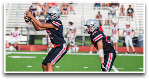 Three football players are standing on the field, one of them is smiling and wearing a black jersey with the number 55. AI generated content