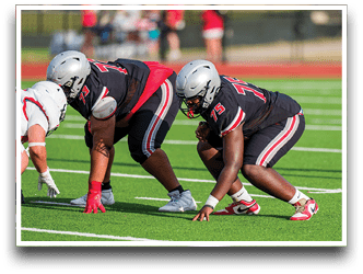 Three football players are standing on the field, one of them is smiling and wearing a black jersey with the number 55. AI generated content