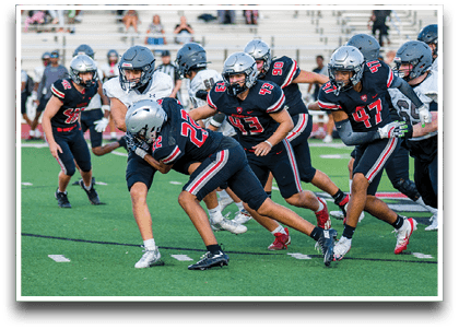 Three football players are standing on the field, one of them is smiling and wearing a black jersey with the number 55. AI generated content