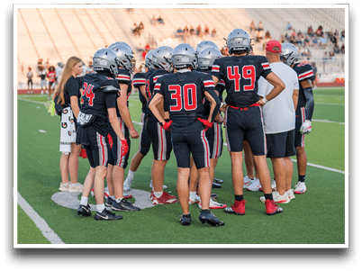 Three football players are standing on the field, one of them is smiling and wearing a black jersey with the number 55. AI generated content