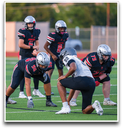 Three football players are standing on the field, one of them is smiling and wearing a black jersey with the number 55. AI generated content