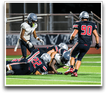 Three football players are standing on the field, one of them is smiling and wearing a black jersey with the number 55. AI generated content