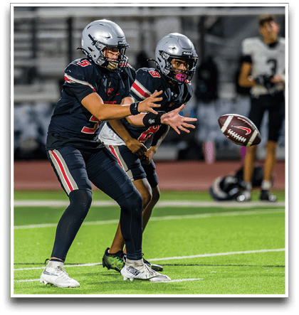 Three football players are standing on the field, one of them is smiling and wearing a black jersey with the number 55. AI generated content