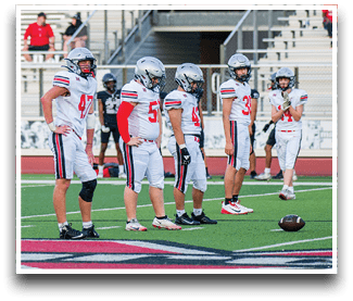 Three football players are standing on the field, one of them is smiling and wearing a black jersey with the number 55. AI generated content