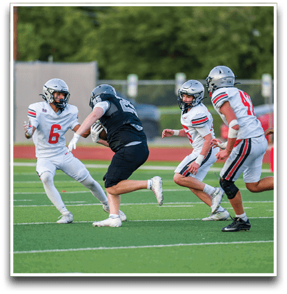 Three football players are standing on the field, one of them is smiling and wearing a black jersey with the number 55. AI generated content
