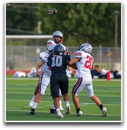 Three football players are standing on the field, one of them is smiling and wearing a black jersey with the number 55. AI generated content