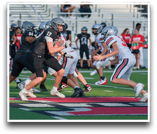 Three football players are standing on the field, one of them is smiling and wearing a black jersey with the number 55. AI generated content