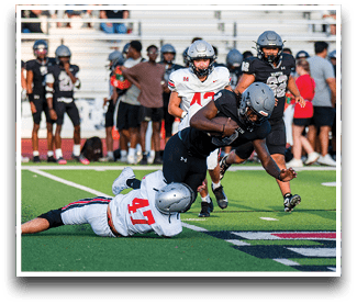 Three football players are standing on the field, one of them is smiling and wearing a black jersey with the number 55. AI generated content