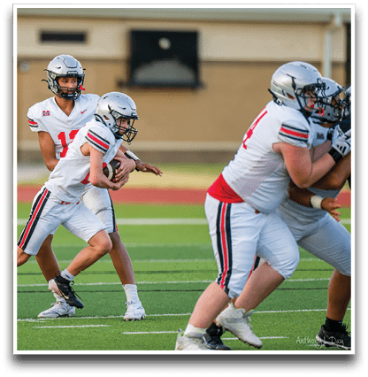 Three football players are standing on the field, one of them is smiling and wearing a black jersey with the number 55. AI generated content