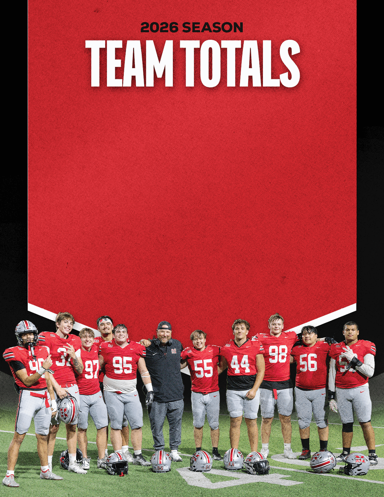 A group of football players standing on a field. Description generated by AI