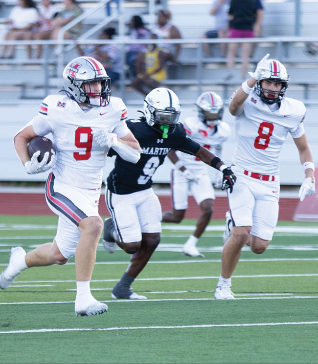 Three football players are standing on the field, one of them is smiling and wearing a black jersey with the number 55. AI generated content