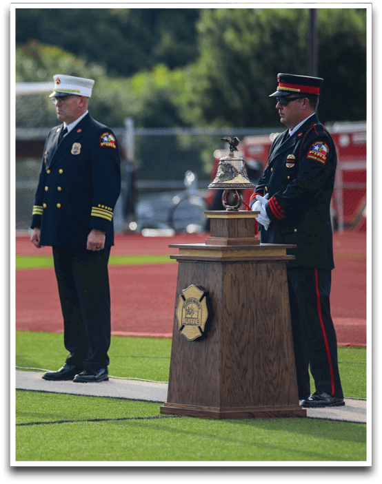 Three football players are standing on the field, one of them is smiling and wearing a black jersey with the number 55. AI generated content