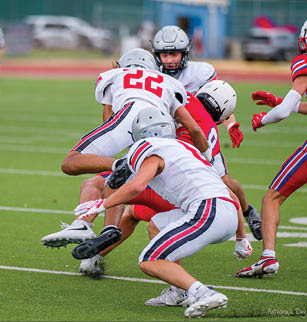 Three football players are standing on the field, one of them is smiling and wearing a black jersey with the number 55. AI generated content