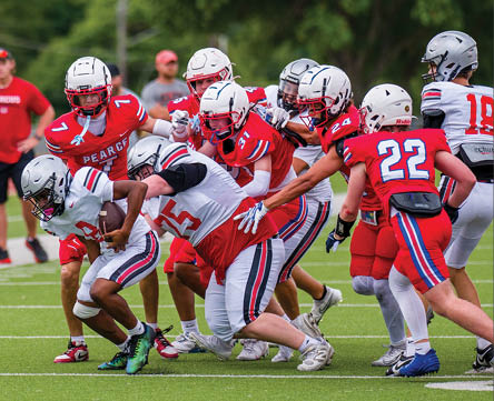 Three football players are standing on the field, one of them is smiling and wearing a black jersey with the number 55. AI generated content