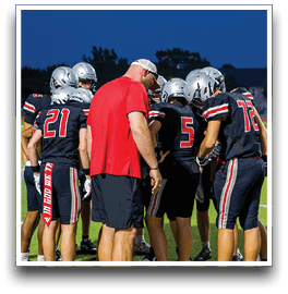 Three football players are standing on the field, one of them is smiling and wearing a black jersey with the number 55. AI generated content