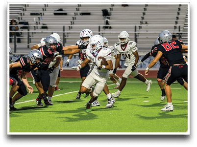 Three football players are standing on the field, one of them is smiling and wearing a black jersey with the number 55. AI generated content