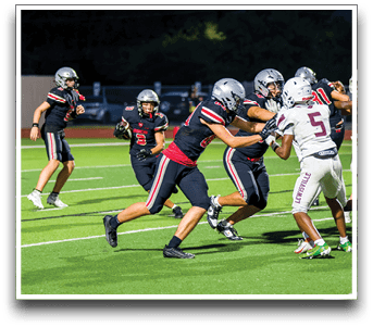 Three football players are standing on the field, one of them is smiling and wearing a black jersey with the number 55. AI generated content