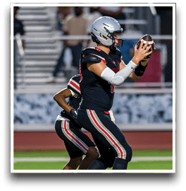 Three football players are standing on the field, one of them is smiling and wearing a black jersey with the number 55. AI generated content