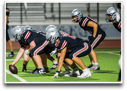 Three football players are standing on the field, one of them is smiling and wearing a black jersey with the number 55. AI generated content