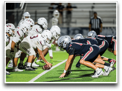 Three football players are standing on the field, one of them is smiling and wearing a black jersey with the number 55. AI generated content