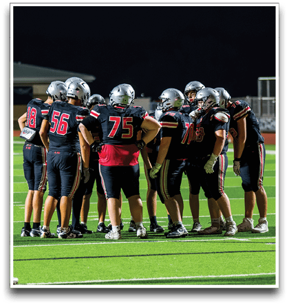 Three football players are standing on the field, one of them is smiling and wearing a black jersey with the number 55. AI generated content