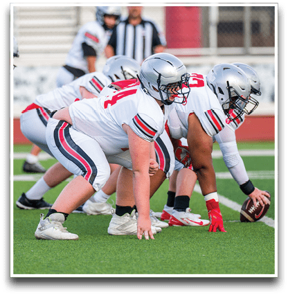 Three football players are standing on the field, one of them is smiling and wearing a black jersey with the number 55. AI generated content