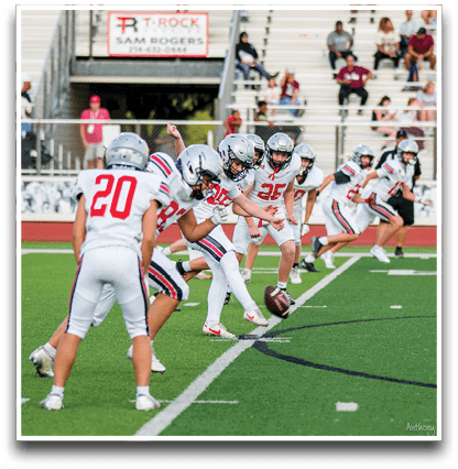 Three football players are standing on the field, one of them is smiling and wearing a black jersey with the number 55. AI generated content