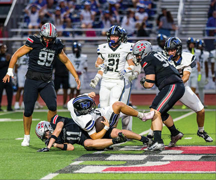 Three football players are standing on the field, one of them is smiling and wearing a black jersey with the number 55. AI generated content