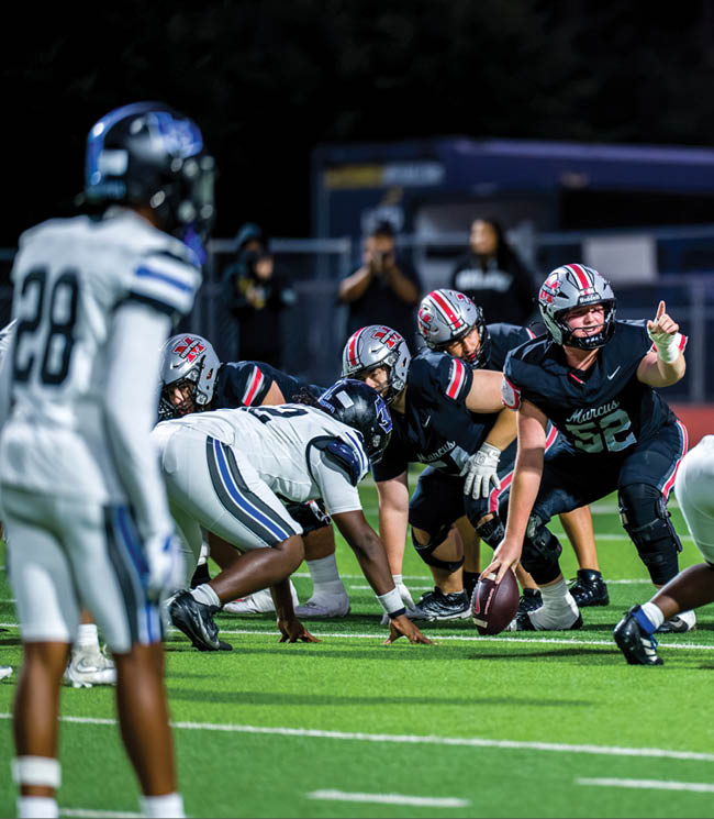 Three football players are standing on the field, one of them is smiling and wearing a black jersey with the number 55. AI generated content