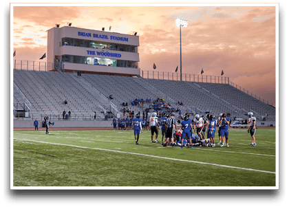 Three football players are standing on the field, one of them is smiling and wearing a black jersey with the number 55. AI generated content