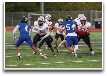 Three football players are standing on the field, one of them is smiling and wearing a black jersey with the number 55. AI generated content