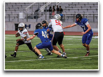 Three football players are standing on the field, one of them is smiling and wearing a black jersey with the number 55. AI generated content