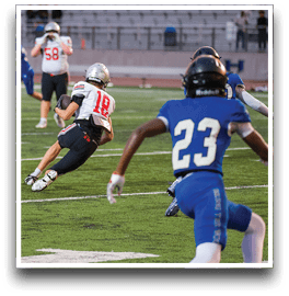 Three football players are standing on the field, one of them is smiling and wearing a black jersey with the number 55. AI generated content
