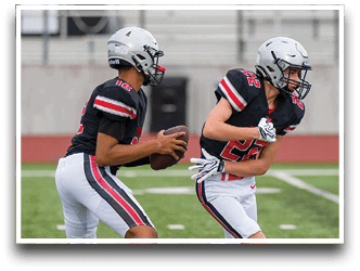 Three football players are standing on the field, one of them is smiling and wearing a black jersey with the number 55. AI generated content