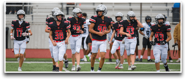 Three football players are standing on the field, one of them is smiling and wearing a black jersey with the number 55. AI generated content