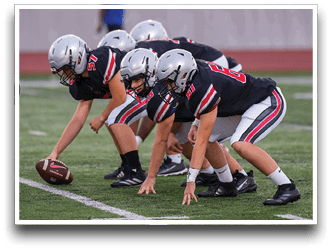 Three football players are standing on the field, one of them is smiling and wearing a black jersey with the number 55. AI generated content