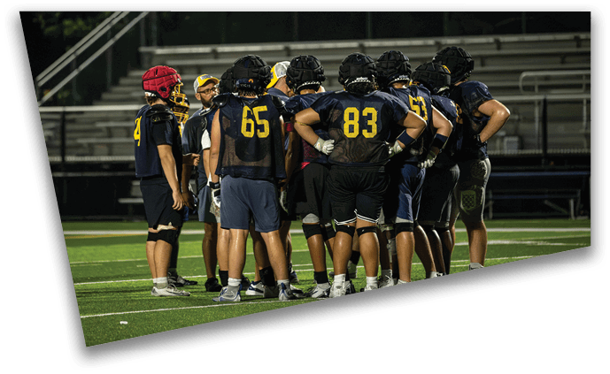 A group of football players wearing blue and yellow uniforms are standing on a field. AI generated content